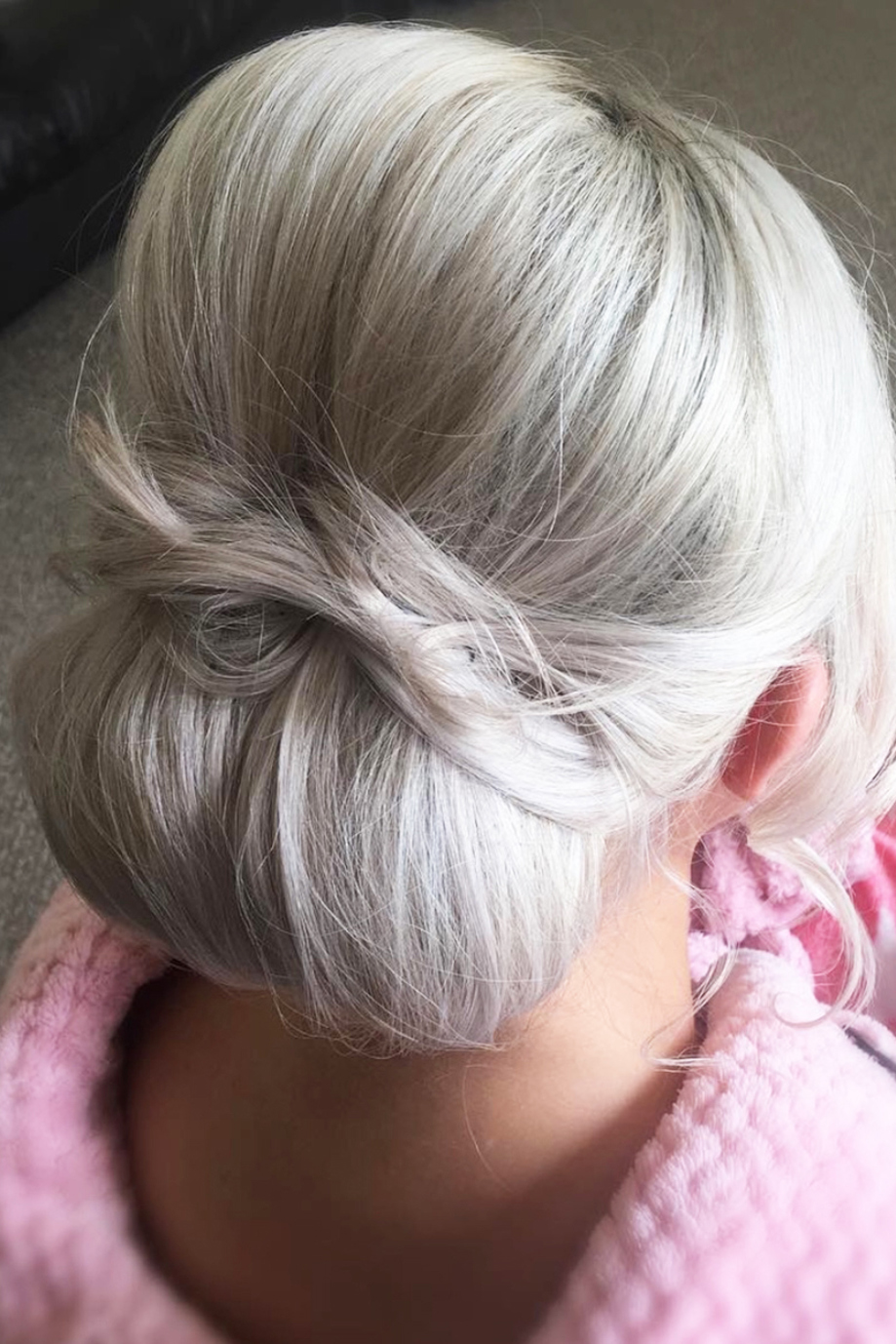 Blonde hair updo with low bun